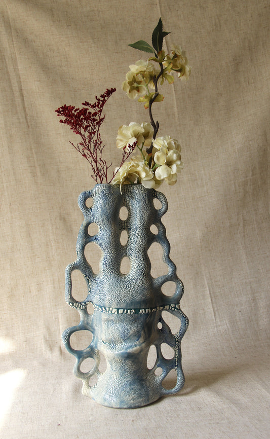 BLUE AND WHITE CERAMIC VASE WITH SCULPTURAL HANDLES AND A TEXTURED “LICHEN” GLAZE