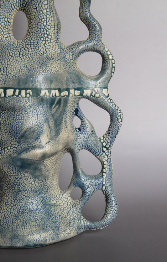 BLUE AND WHITE CERAMIC VASE WITH SCULPTURAL HANDLES AND A TEXTURED “LICHEN” GLAZE